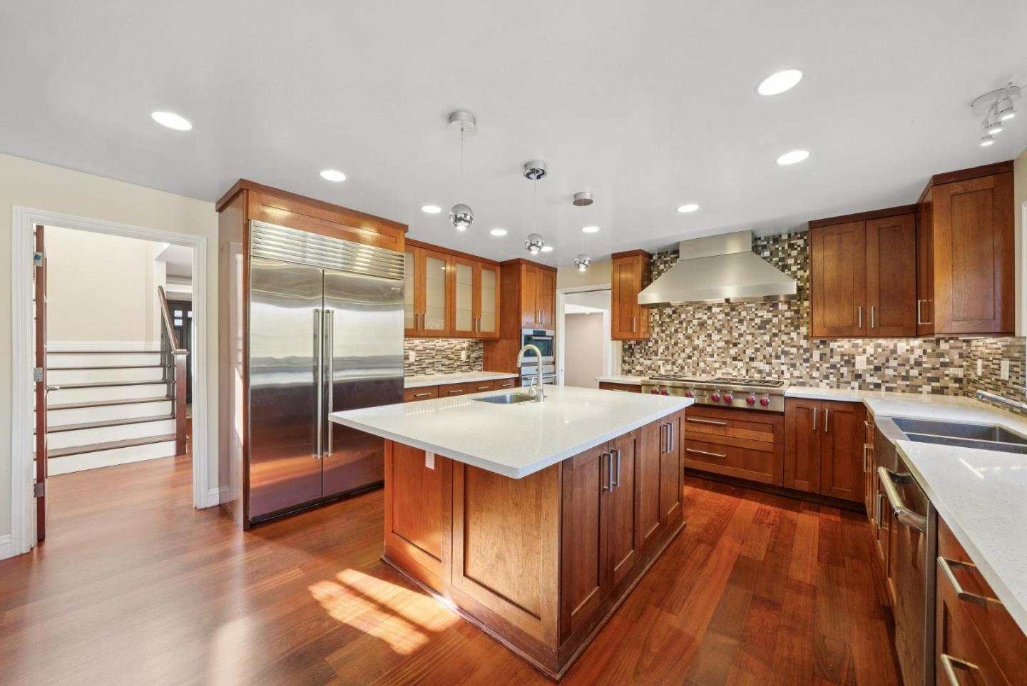 900 Highlands Circle Los Altos, CA 94024 - Photo 13 of 76 a kitchen with stainless steel appliances granite countertop a sink stove and refrigerator