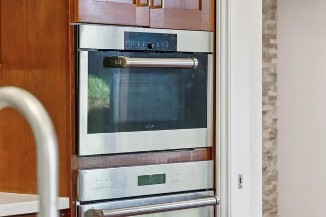 a bathroom with a black and white shower curtain