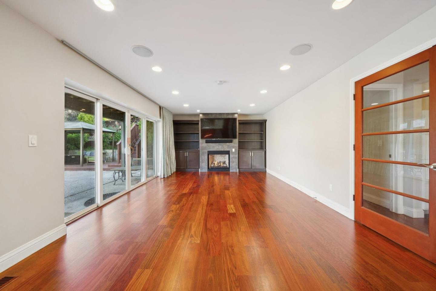 900 Highlands Circle Los Altos, CA 94024 - Photo 24 of 76 a view of an empty room with wooden floor and a window