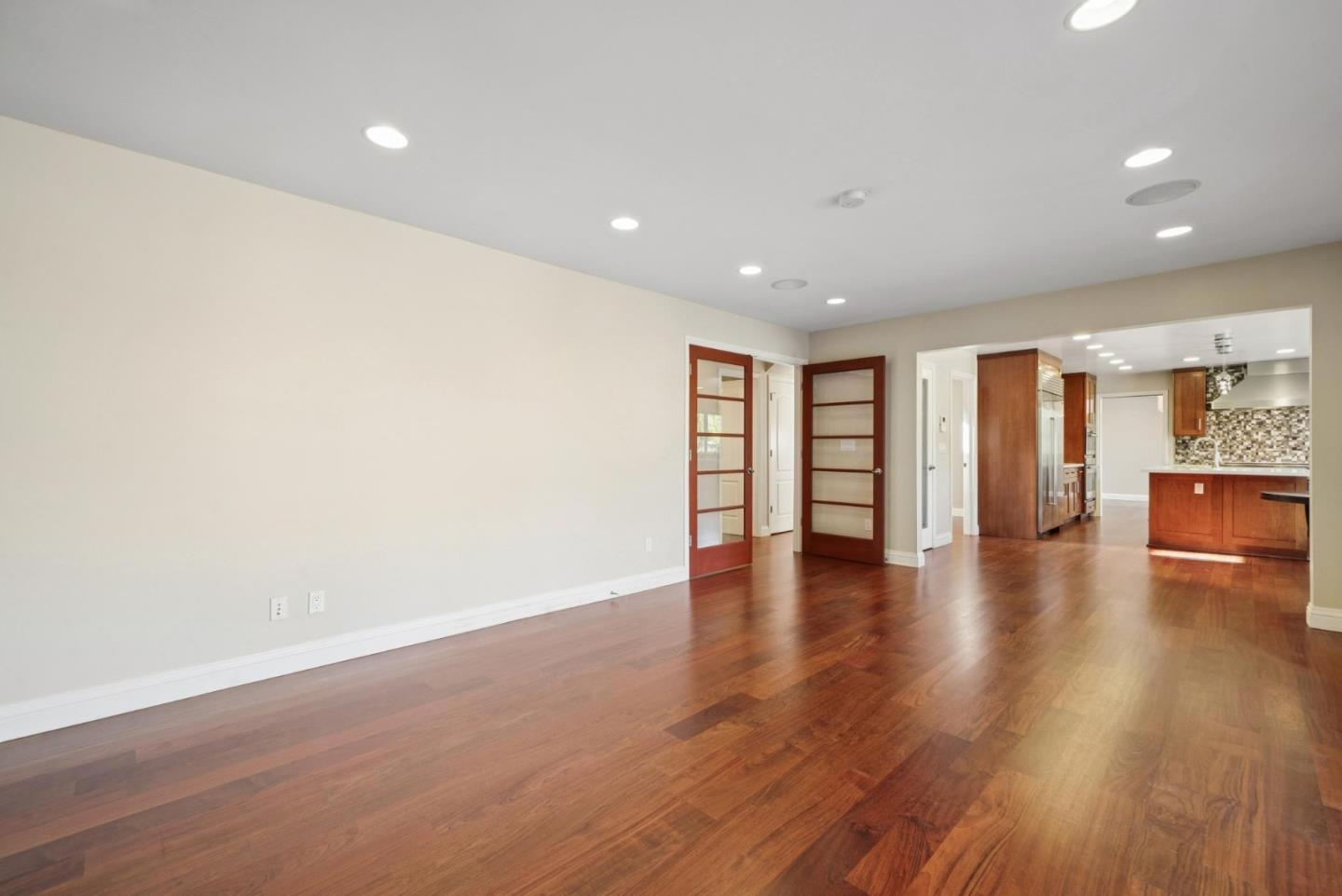 900 Highlands Circle Los Altos, CA 94024 - Photo 26 of 76 a view of an empty room with wooden floor and windows