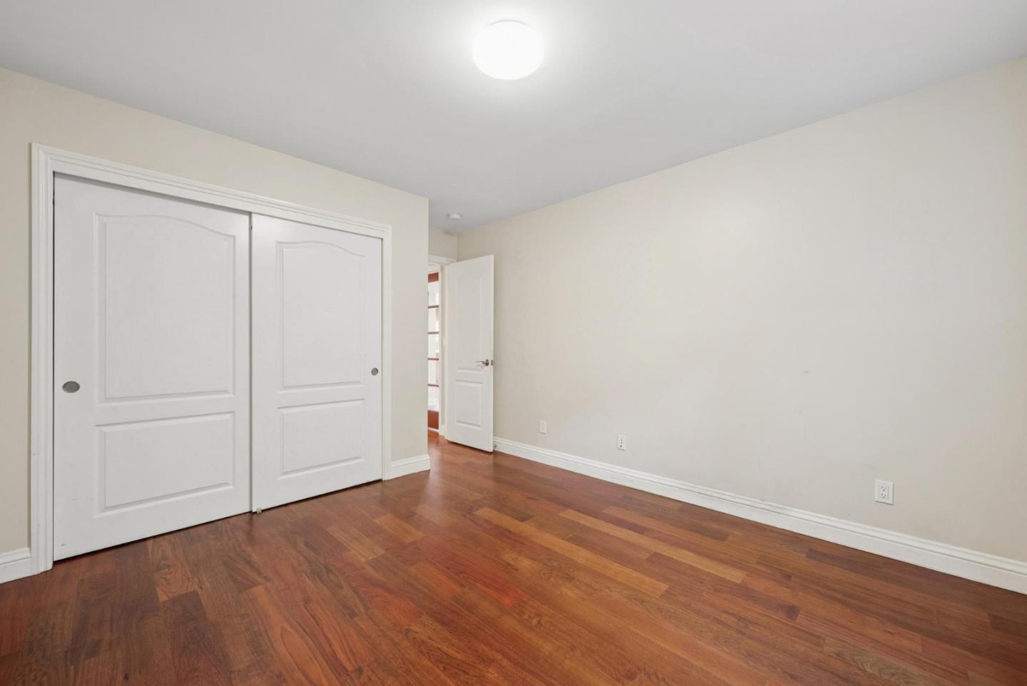 900 Highlands Circle Los Altos, CA 94024 - Photo 28 of 76 a view of an empty room with wooden floor