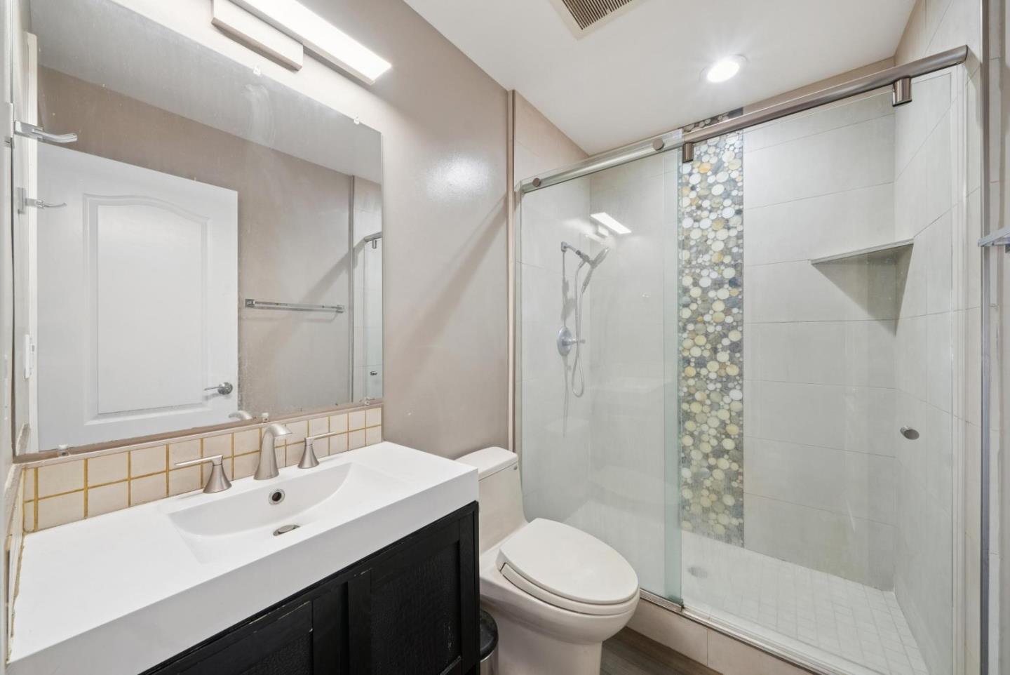 900 Highlands Circle Los Altos, CA 94024 - Photo 29 of 76 a bathroom with a sink shower and a toilet