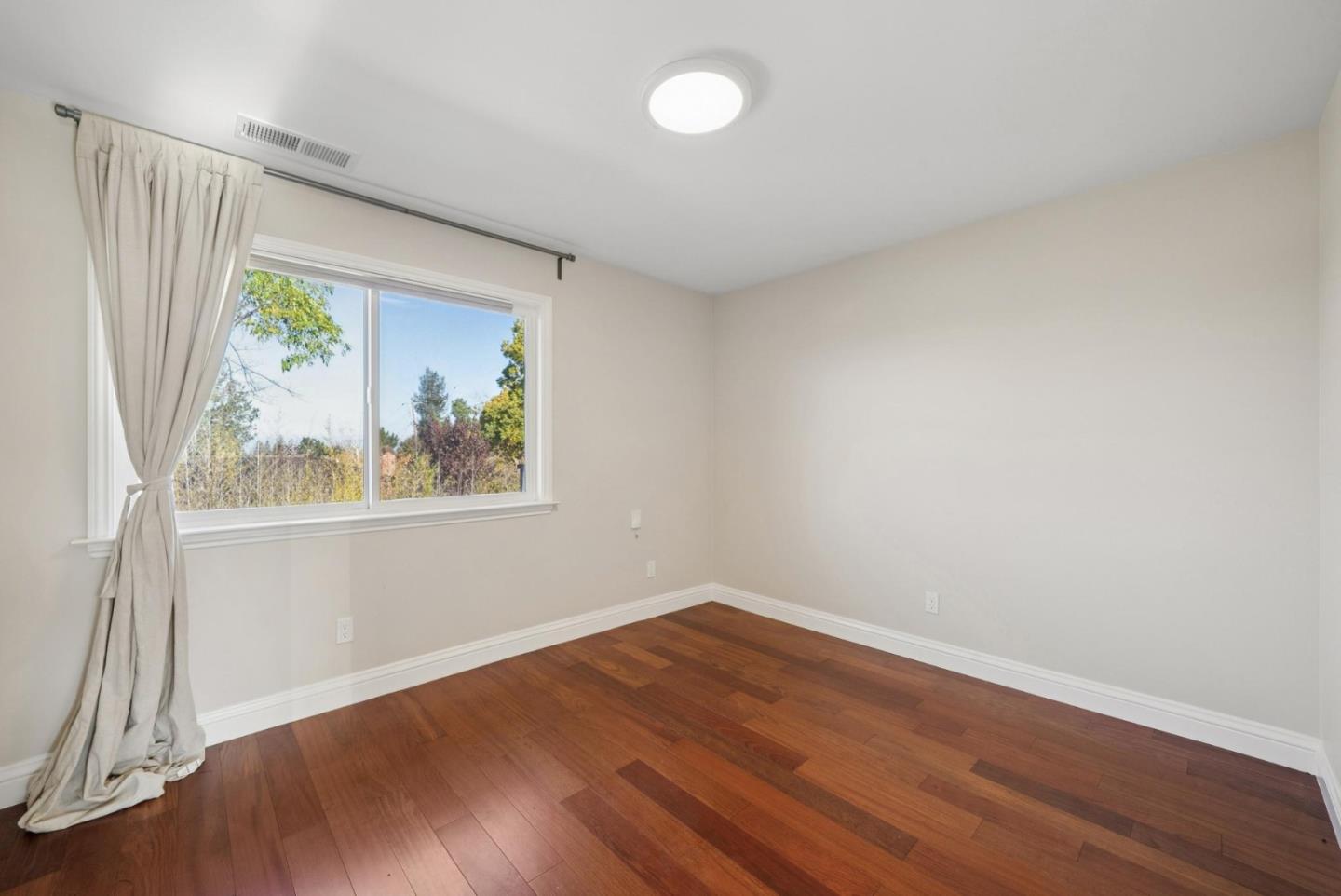 900 Highlands Circle Los Altos, CA 94024 - Photo 46 of 76 wooden floor in an empty room with a window