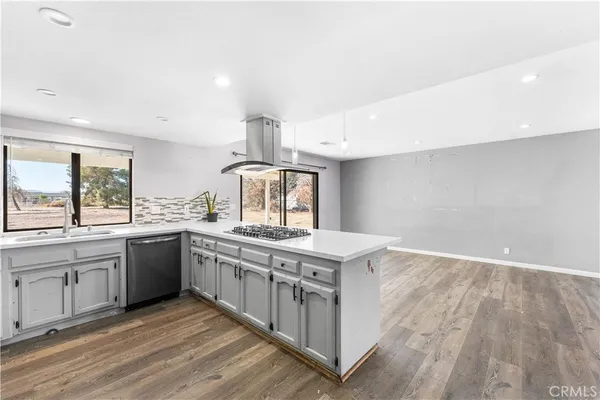 a kitchen with a stove and a sink