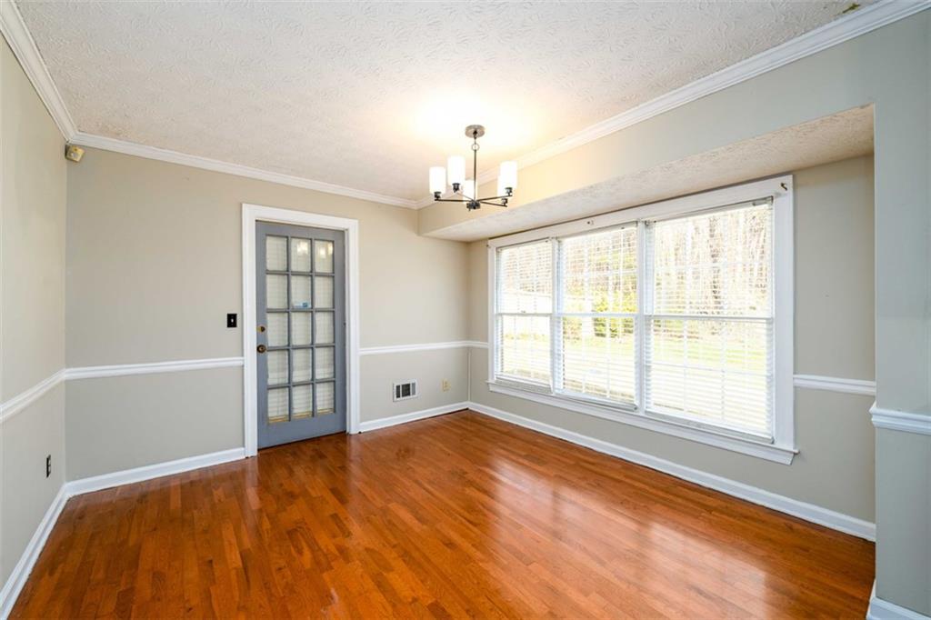 6420 Phillips Place Lithonia, GA 30058 - Photo 15 of 40 a view of an empty room with a window