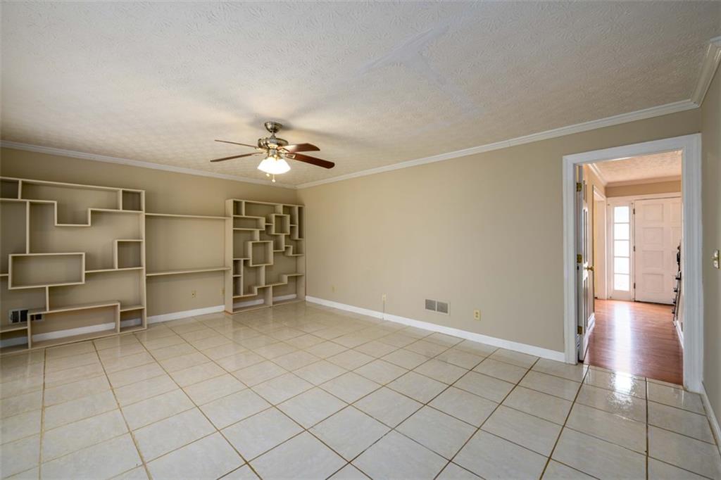 6420 Phillips Place Lithonia, GA 30058 - Photo 19 of 40 a view of an empty room with a window