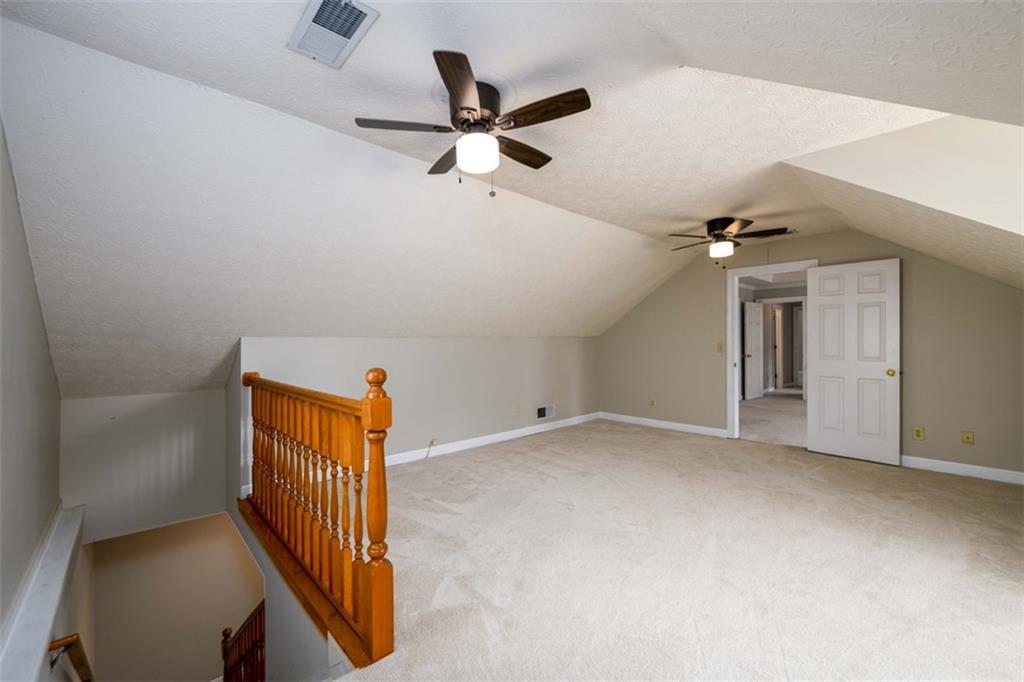 6420 Phillips Place Lithonia, GA 30058 - Photo 22 of 40 a view of a livingroom with a ceiling fan