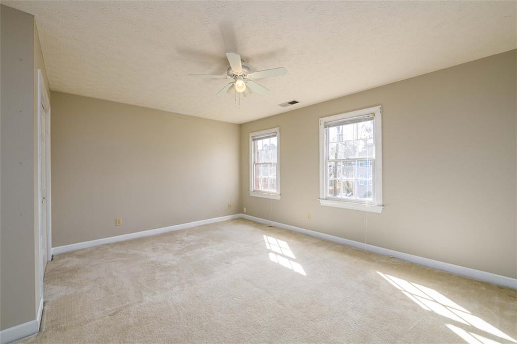 6420 Phillips Place Lithonia, GA 30058 - Photo 28 of 40 a view of an empty room with a window