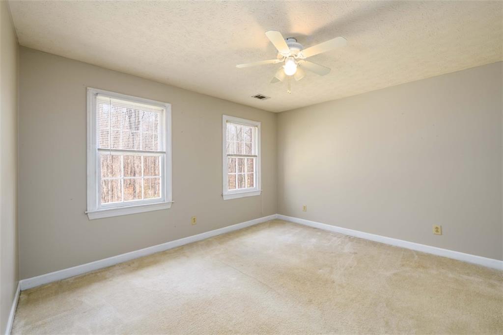 6420 Phillips Place Lithonia, GA 30058 - Photo 30 of 40 an empty room with a window