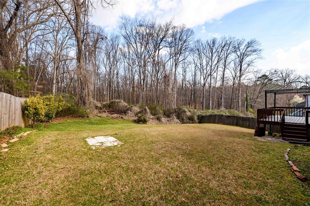 6420 Phillips Place Lithonia, GA 30058 - Photo 37 of 40 a backyard of a house with table and chairs