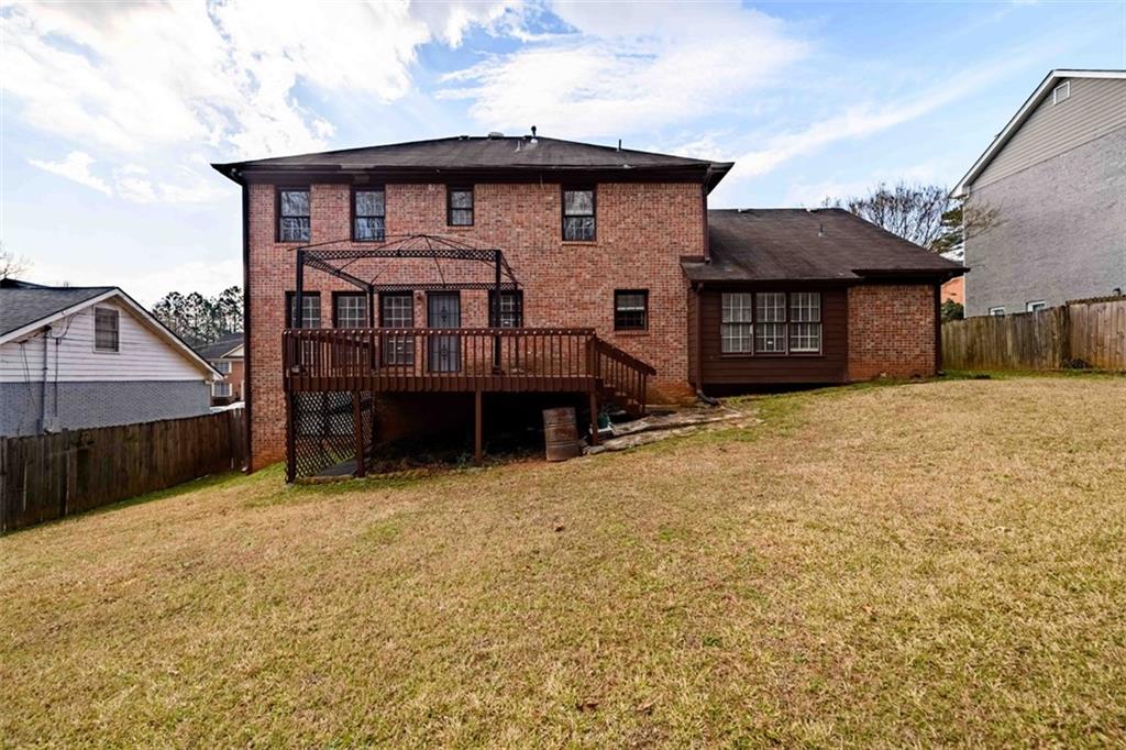 6420 Phillips Place Lithonia, GA 30058 - Photo 38 of 40 a view of a house with a yard