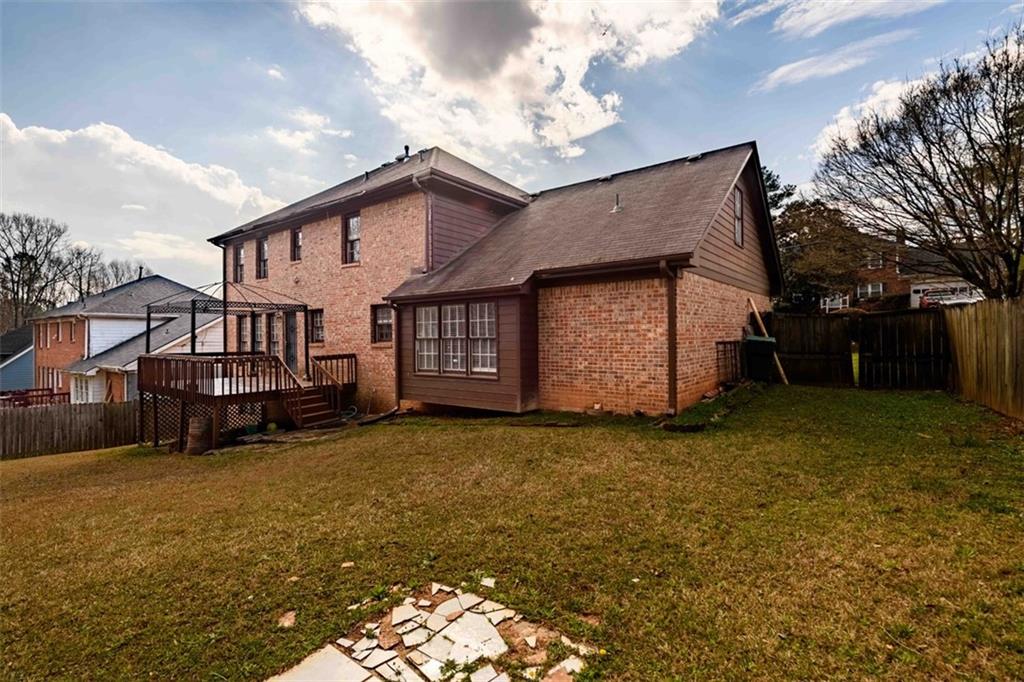 6420 Phillips Place Lithonia, GA 30058 - Photo 39 of 40 a view of a house with a yard