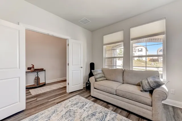 a living room with furniture and a window