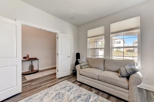 a living room with furniture and a window
