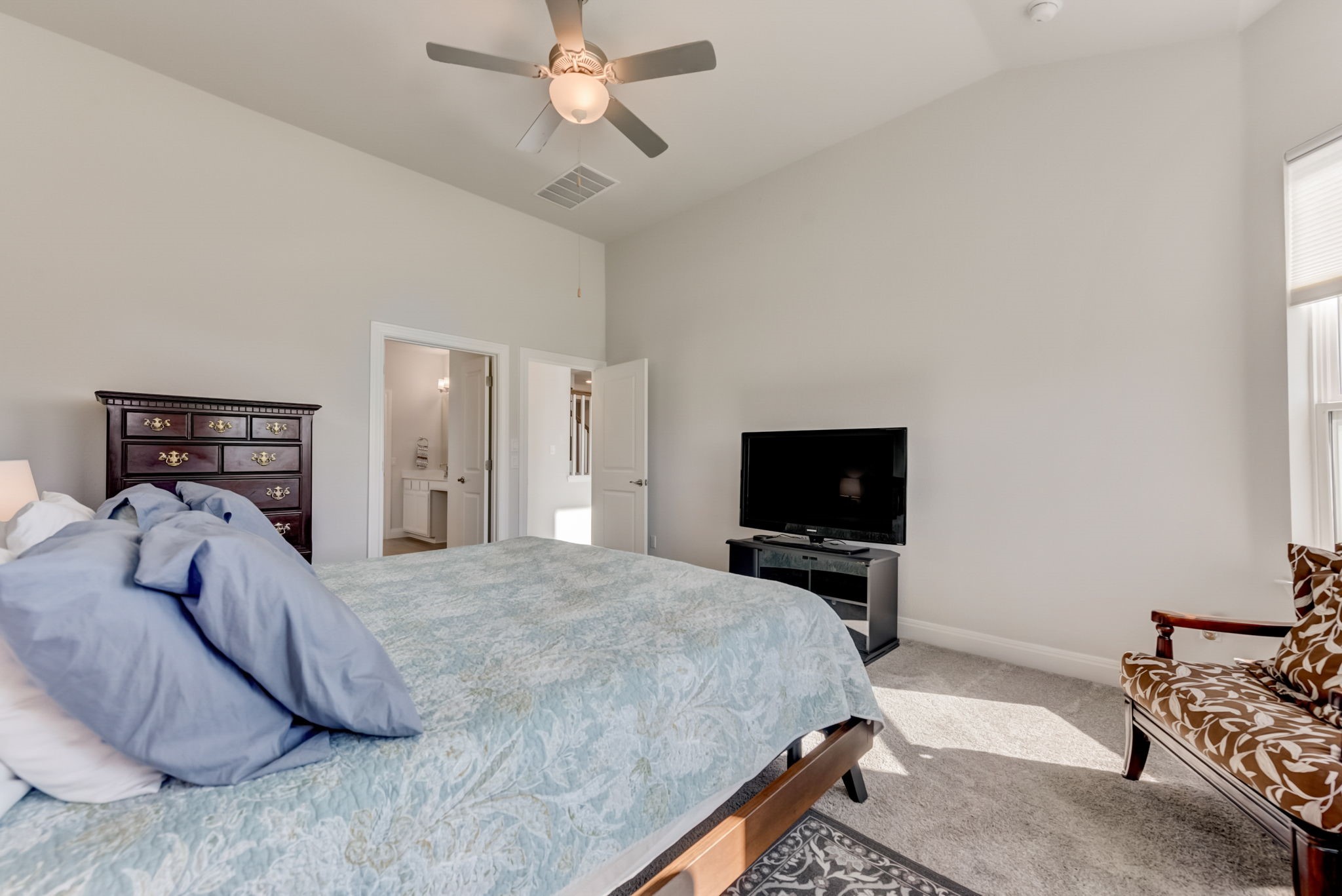2121 Prairie Oaks Drive Georgetown, TX 78628 - Photo 18 of 40 a bedroom with a bed and a flat screen tv