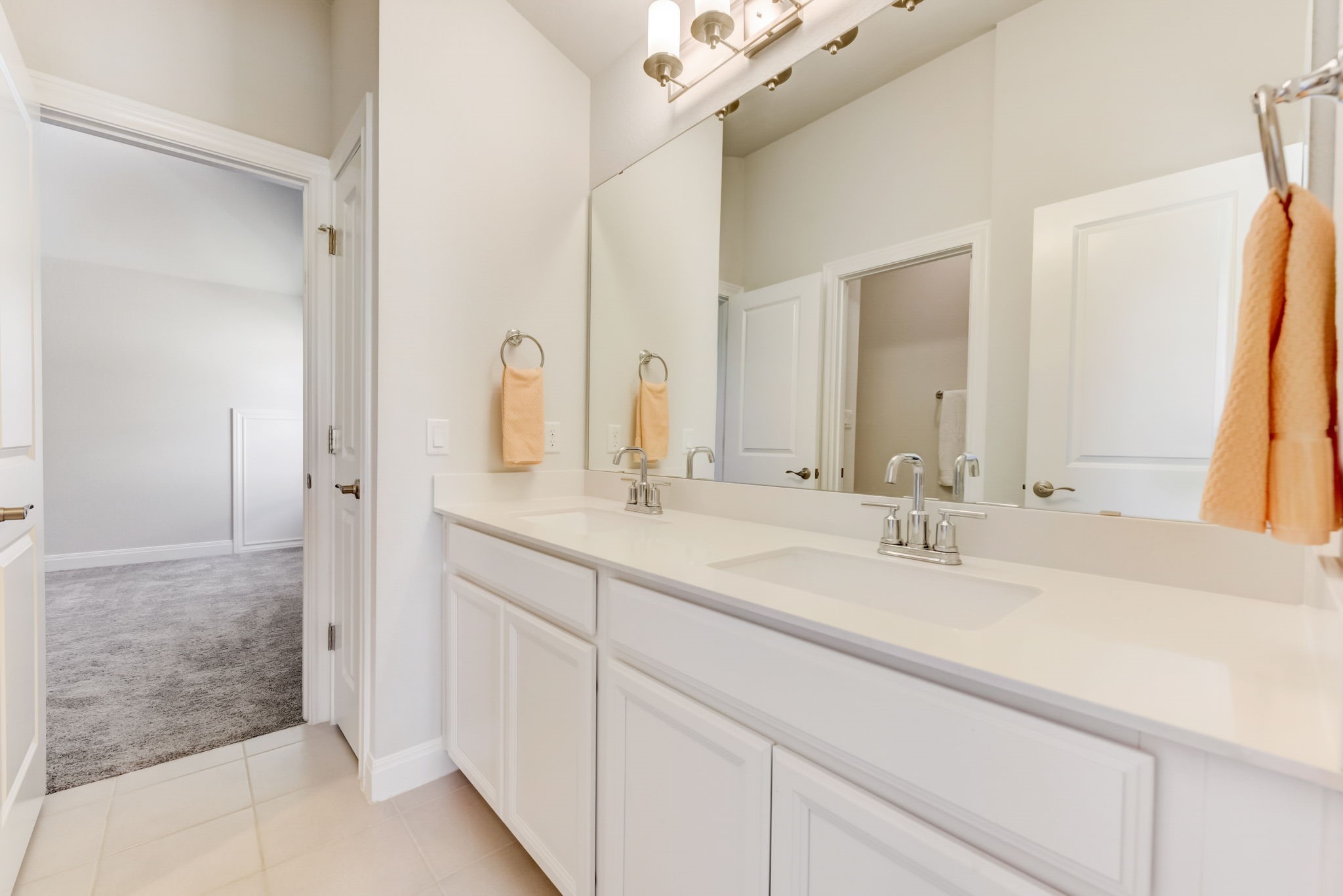 2121 Prairie Oaks Drive Georgetown, TX 78628 - Photo 25 of 40 a bathroom with double vanity sinks and a mirror