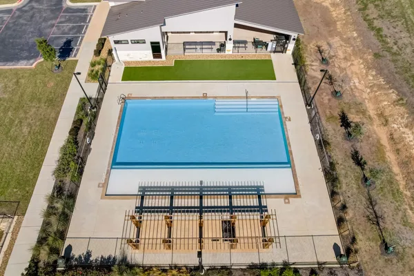 a view of yard with swimming pool