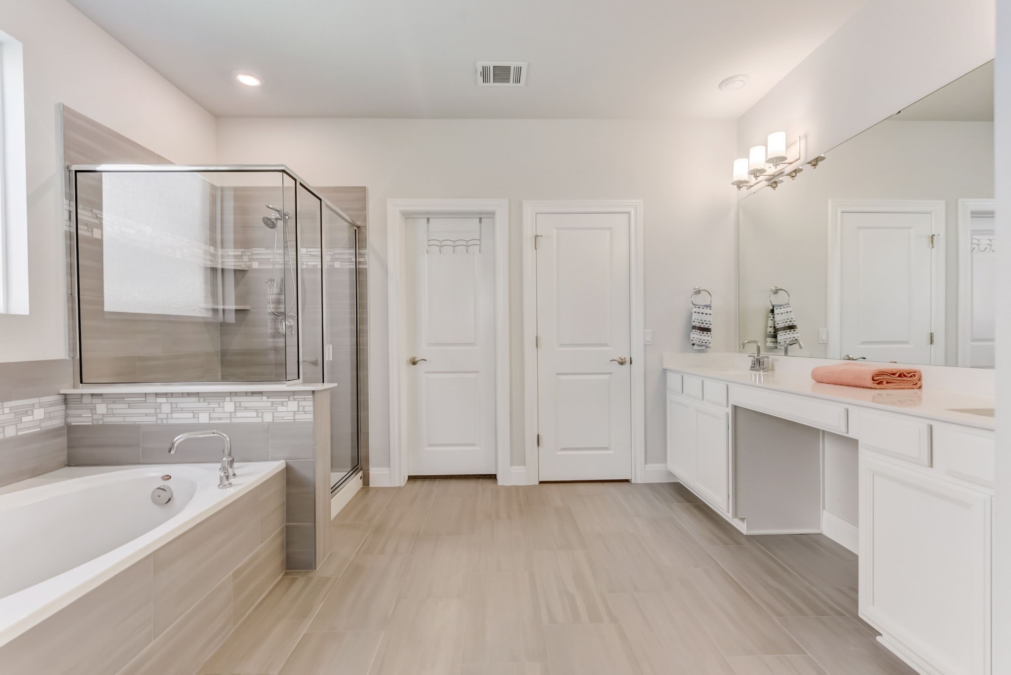 2121 Prairie Oaks Drive Georgetown, TX 78628 - Photo 5 of 40 a bathroom with a bathtub a sink and a shower