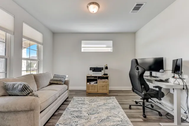a living room with furniture and a window