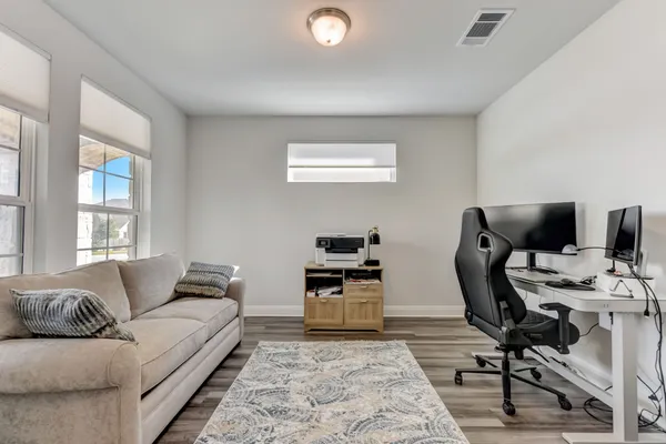 a living room with furniture and a window