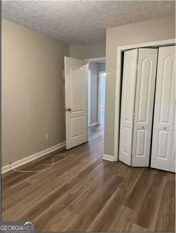 a view of a livingroom with wooden floor