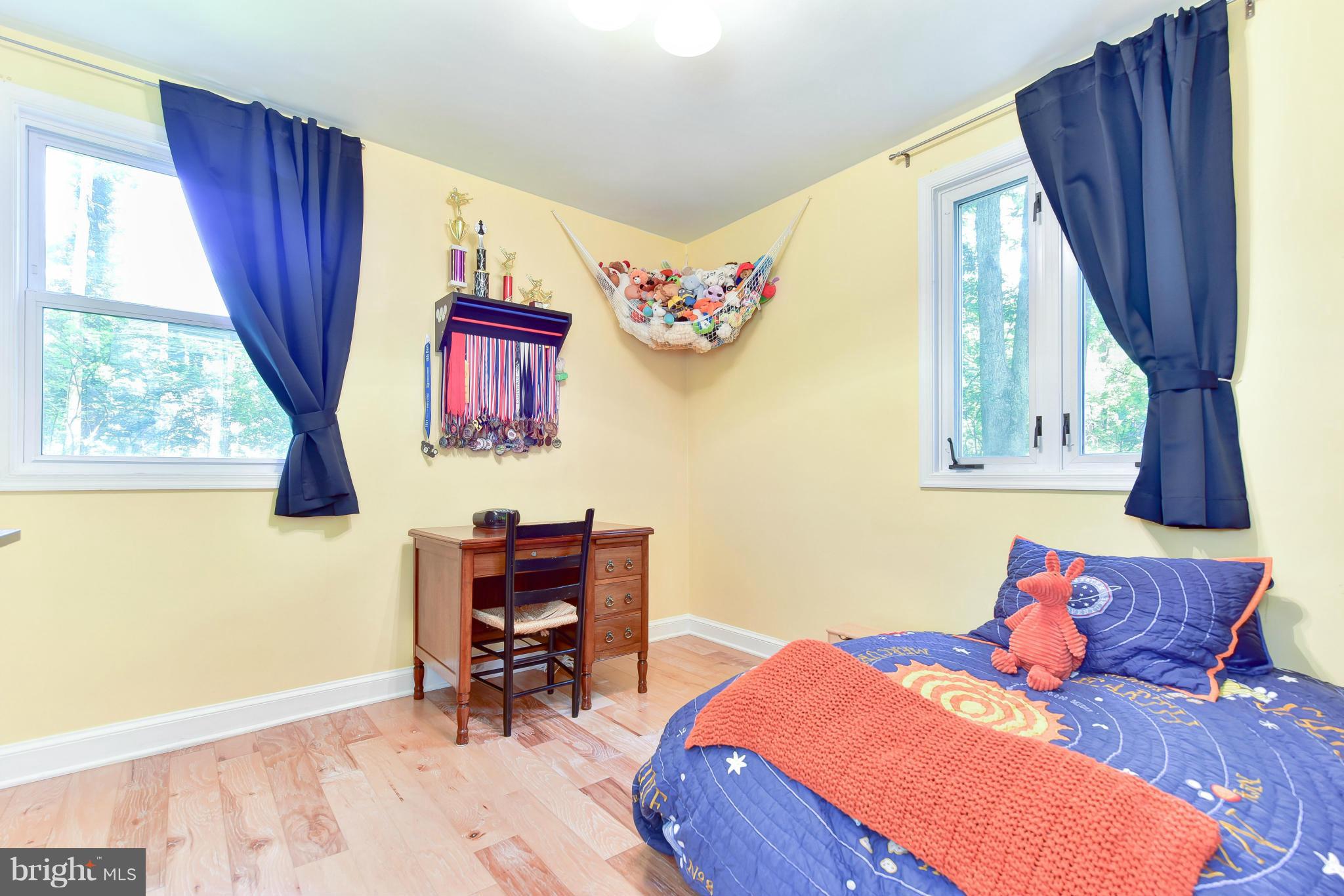 1312 Namassin Road Alexandria, VA 22308 - Photo 15 of 30 a bedroom with a bed and a window