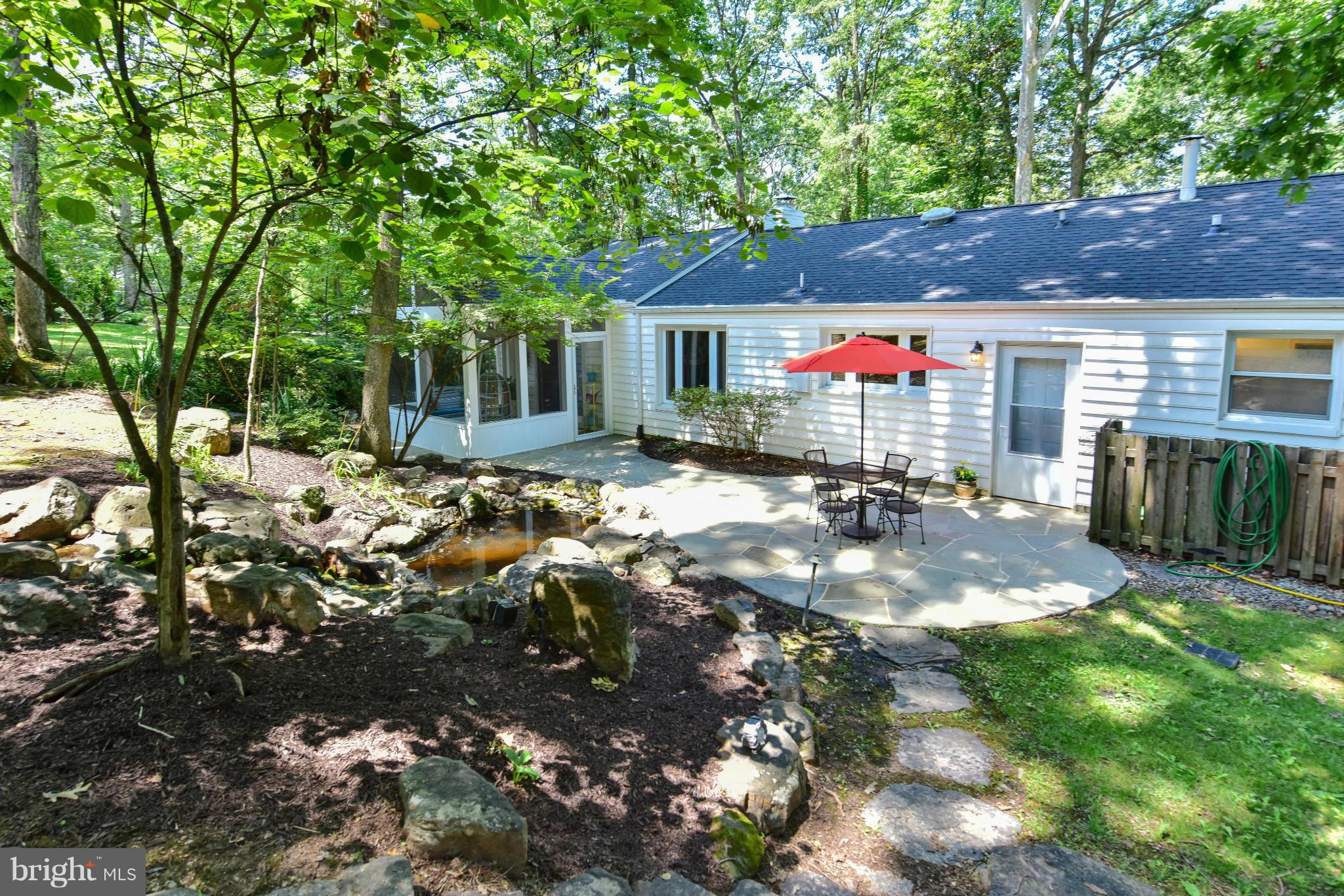 1312 Namassin Road Alexandria, VA 22308 - Photo 22 of 30 a view of a house with a backyard porch and sitting area