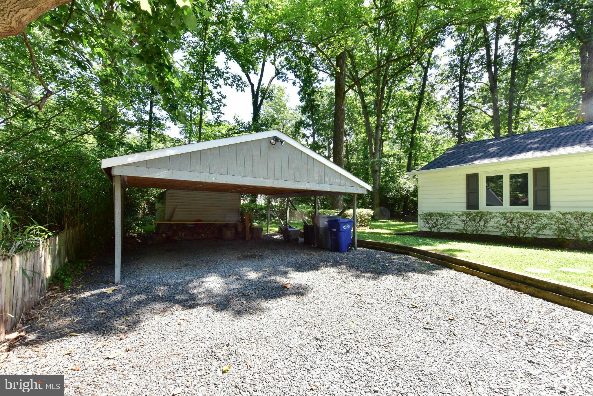 1312 Namassin Road Alexandria, VA 22308 - Photo 27 of 30 a view of a small house with a yard and roof
