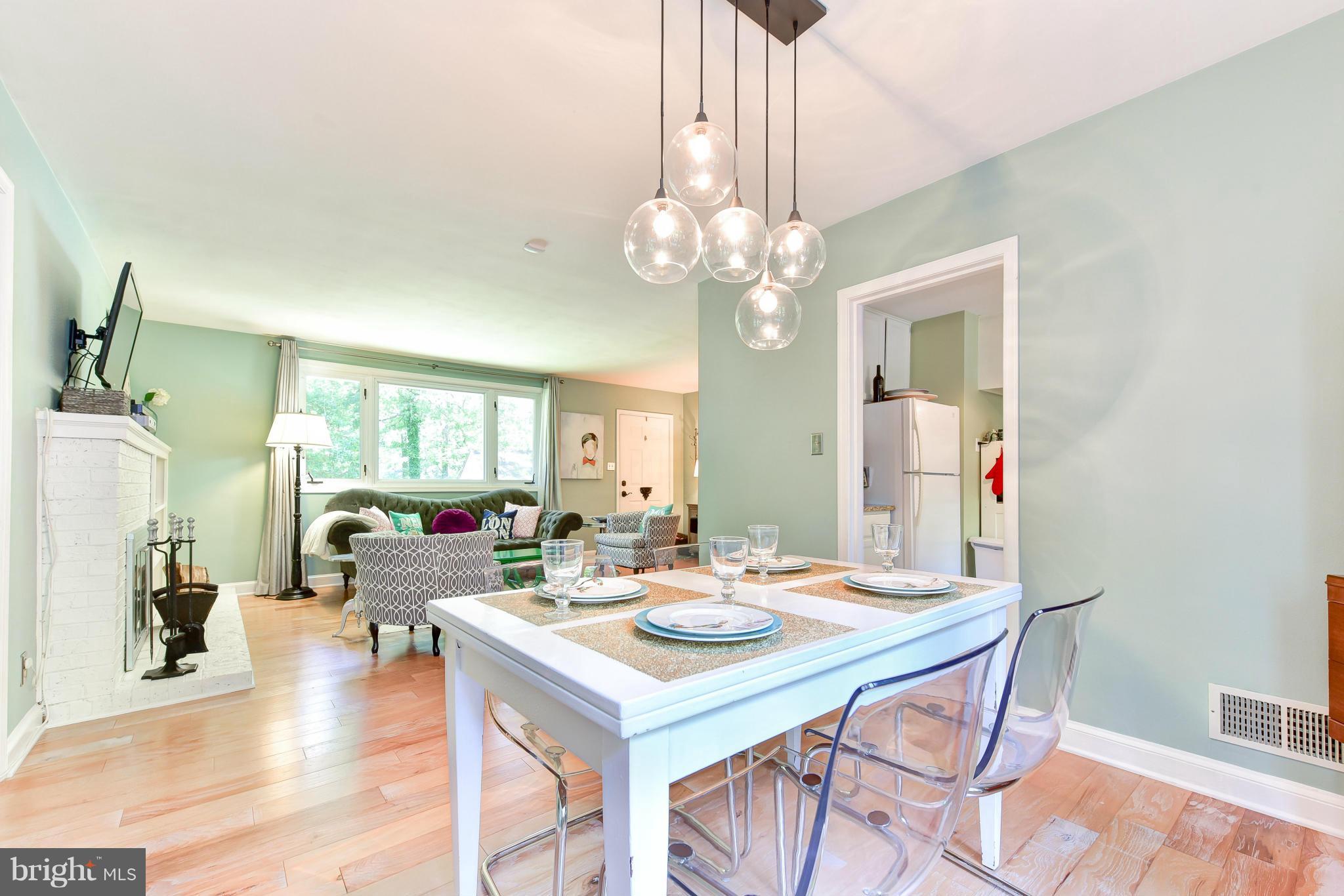 1312 Namassin Road Alexandria, VA 22308 - Photo 6 of 30 a view of a dining room with furniture window and wooden floor