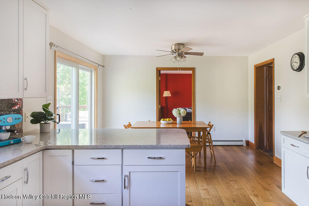 1457 N Road Blenheim, NY 12131 - Photo 12 of 43 a kitchen with sink cabinets and wooden floor