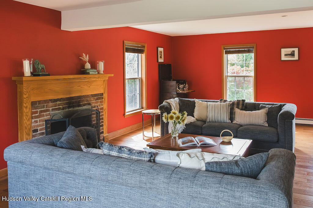 1457 N Road Blenheim, NY 12131 - Photo 13 of 43 a living room with furniture and a fireplace