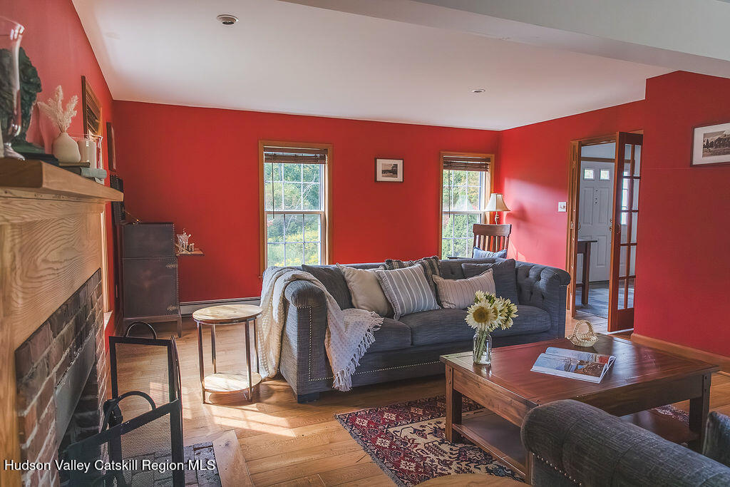1457 N Road Blenheim, NY 12131 - Photo 15 of 43 a living room with furniture and a fireplace