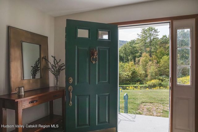 a view of a front door and bedroom