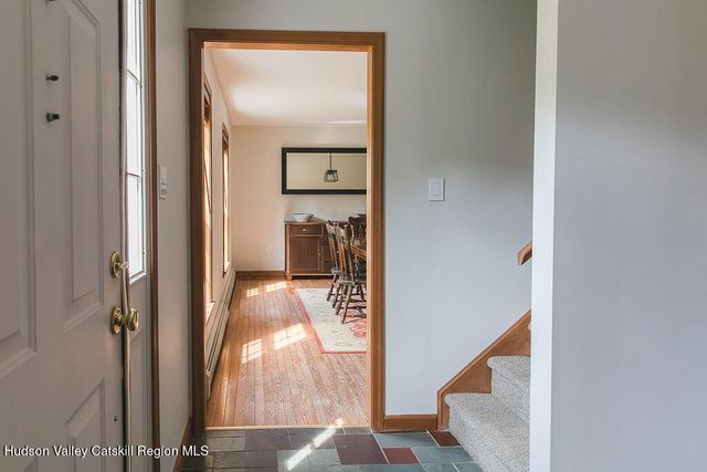a view of hallway with wooden floor