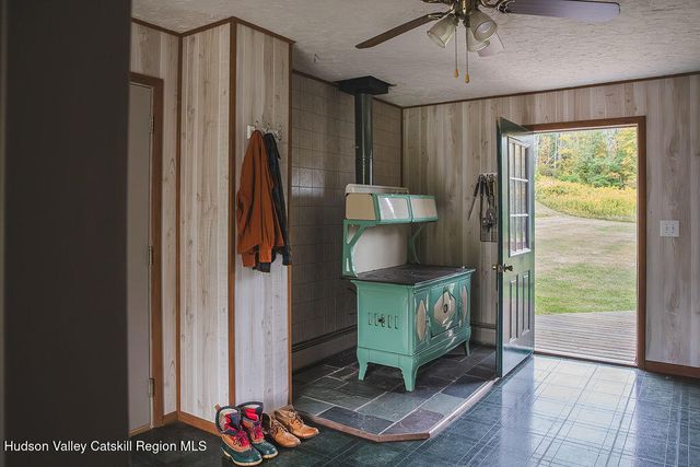 a view of an entryway with wooden floor