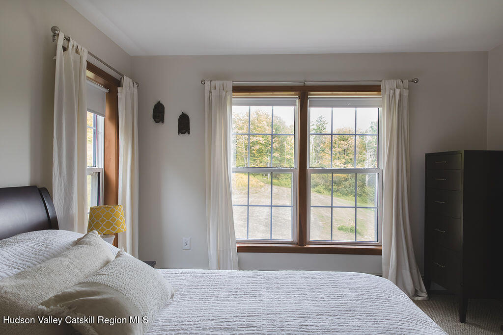 1457 N Road Blenheim, NY 12131 - Photo 28 of 43 a bedroom with a bed and a large window