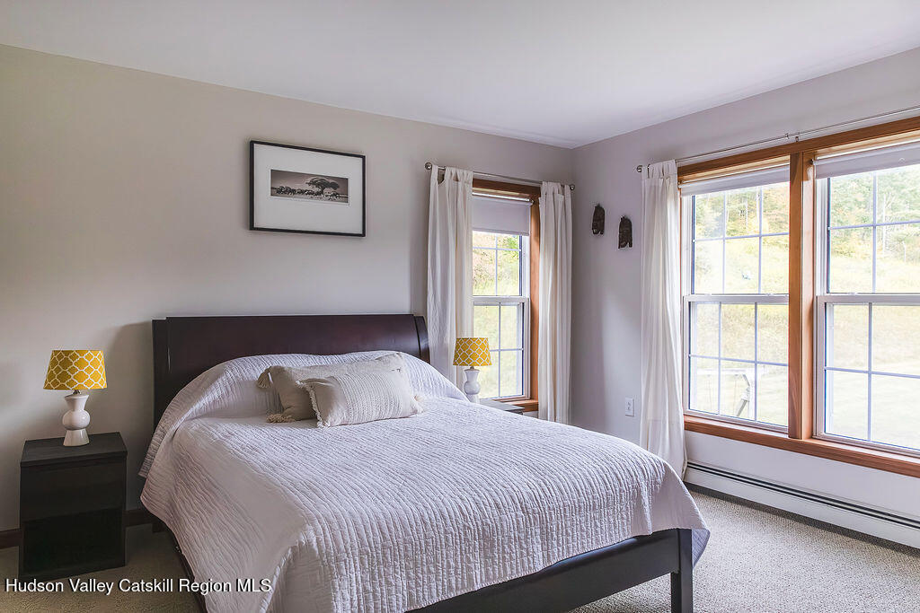 1457 N Road Blenheim, NY 12131 - Photo 29 of 43 a bedroom with a large bed and a window