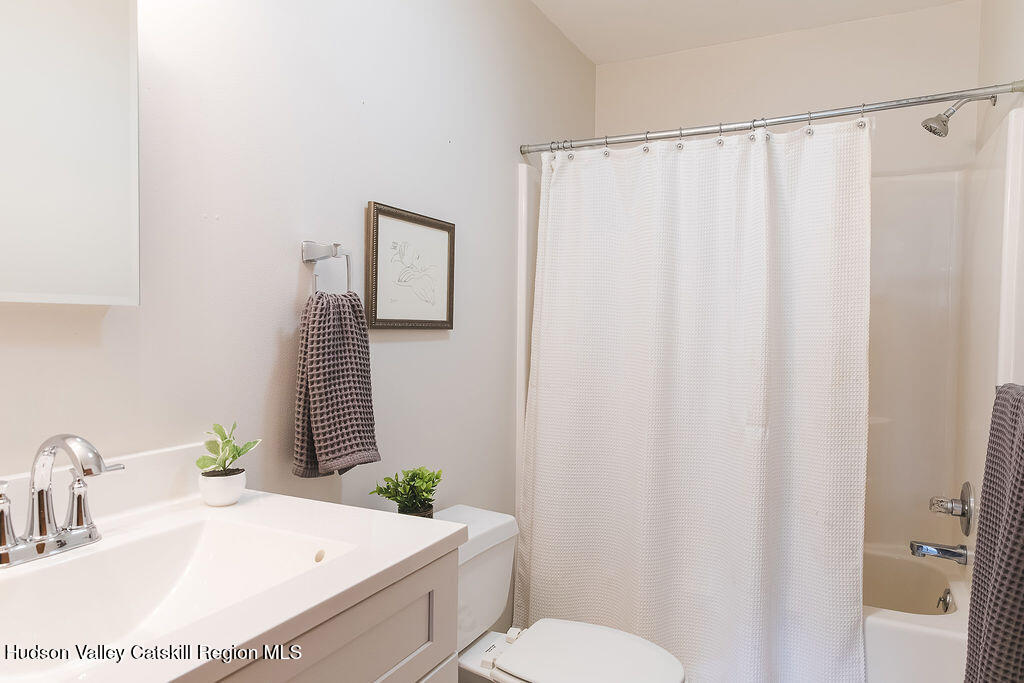 1457 N Road Blenheim, NY 12131 - Photo 30 of 43 a bathroom with a sink toilet and shower