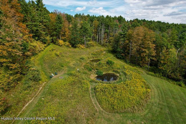 a view of a chairs and table in the garden