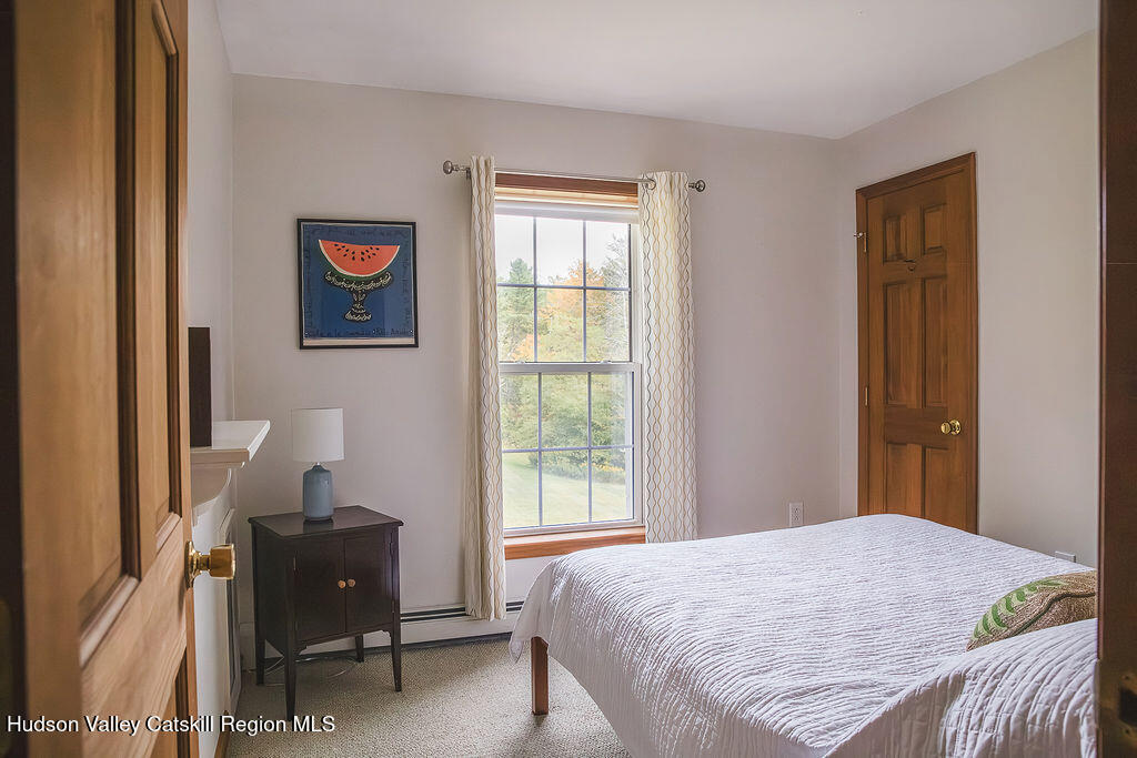 1457 N Road Blenheim, NY 12131 - Photo 5 of 43 a bedroom with a bed and wooden floor