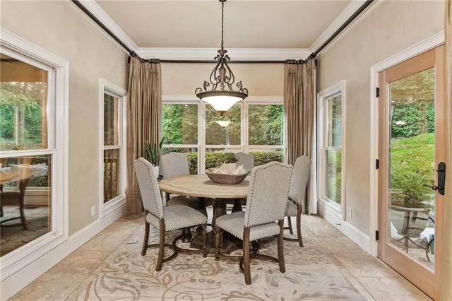 a bathroom with a granite countertop toilet a sink and a mirror