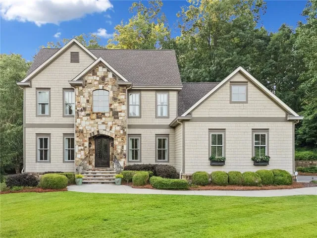 a front view of a house with a yard