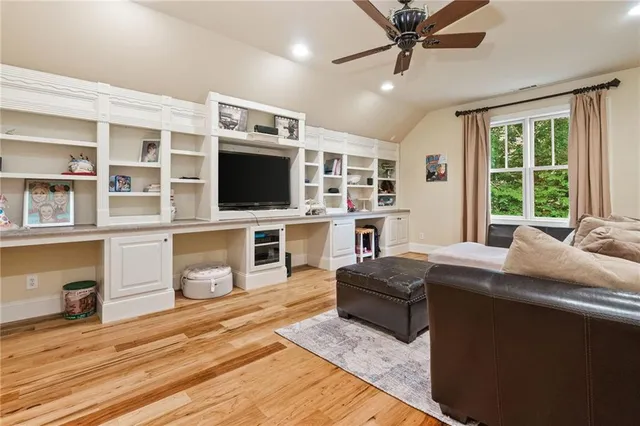 a kitchen with granite countertop a sink stove and cabinets