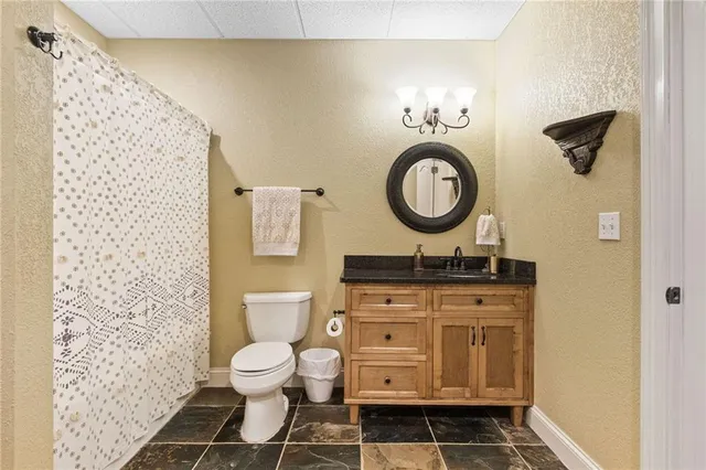 a view of backyard with seating space and trees