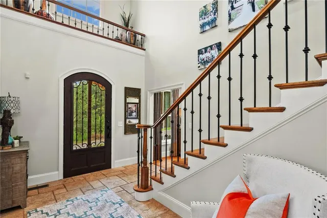 a kitchen with a stove a sink and a wooden cabinets