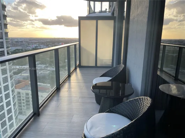 a view of balcony with furniture