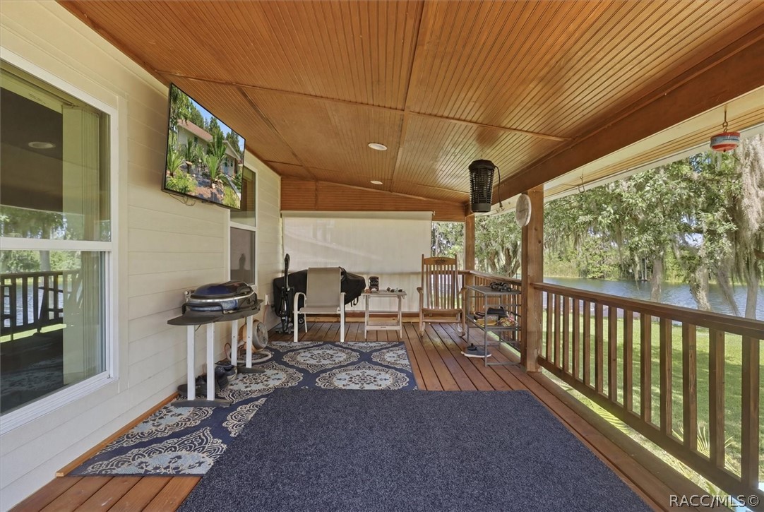 4099 West Ridge Court Dunnellon, FL 34433 - Photo 36 of 49 10.5' x 22.5' back porch. Check out the wood floors and ceilings with protective rails. Enjoy your amazing view and natural surroundings. You can't get much closer to Paradise , than here. You need to come and experience for yourself!