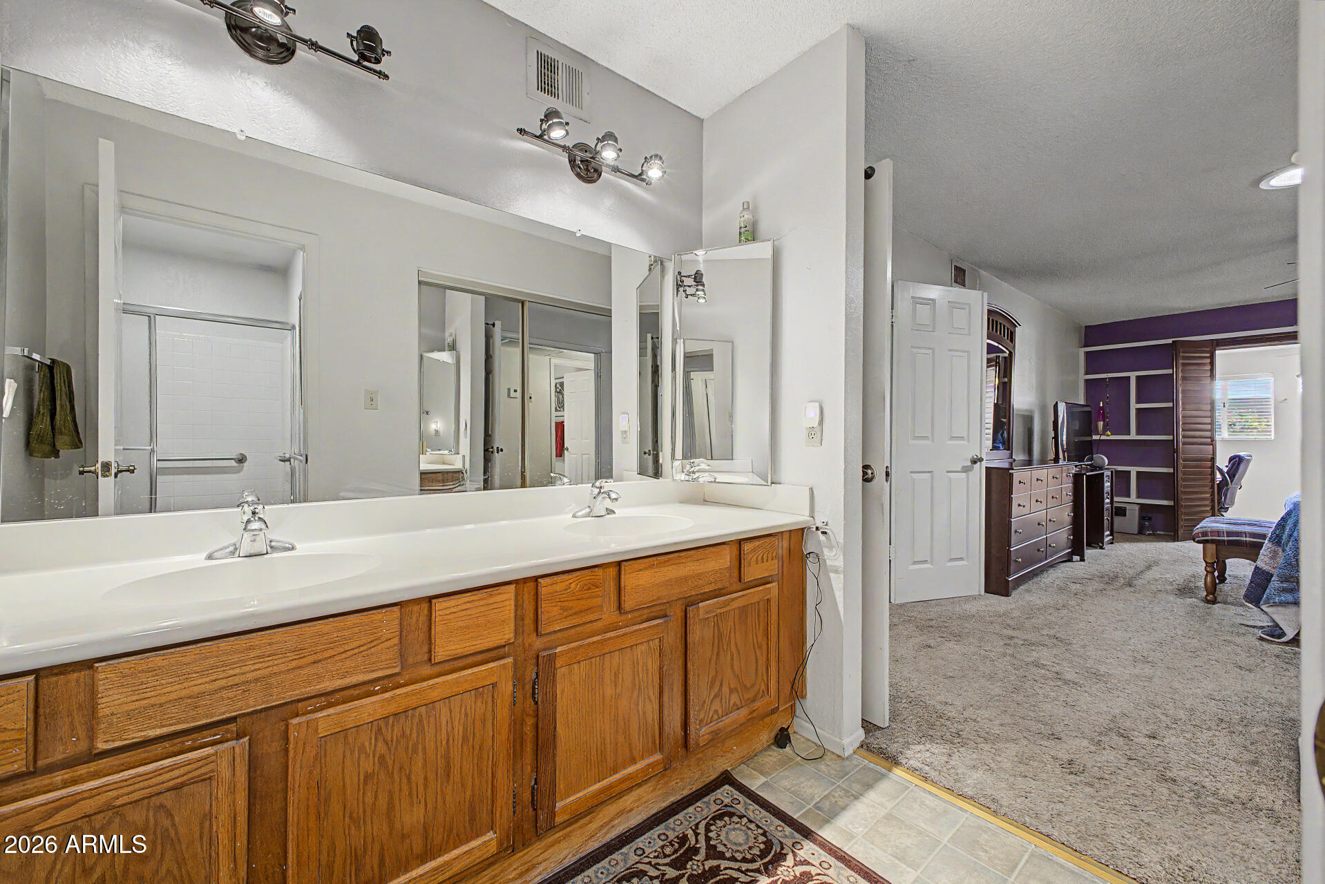 2659 West Hearn Road Phoenix, AZ 85023 - Photo 17 of 25 a spacious bathroom with a double vanity sink mirror and double