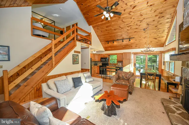 a view of a balcony with yard