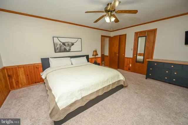 a view of a chair and table in the backyard